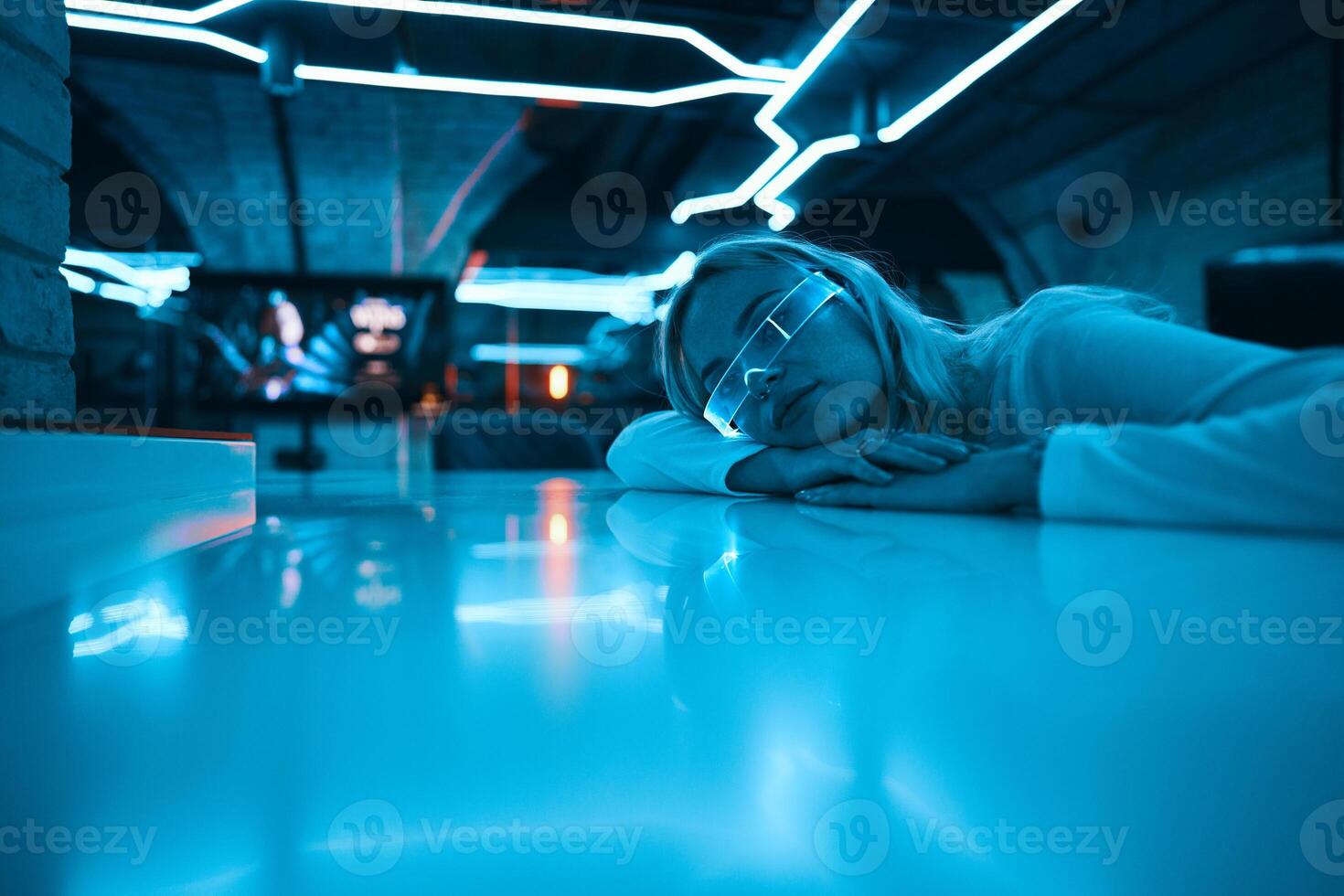Young woman in neon glasses. Cyberpunk style. photo