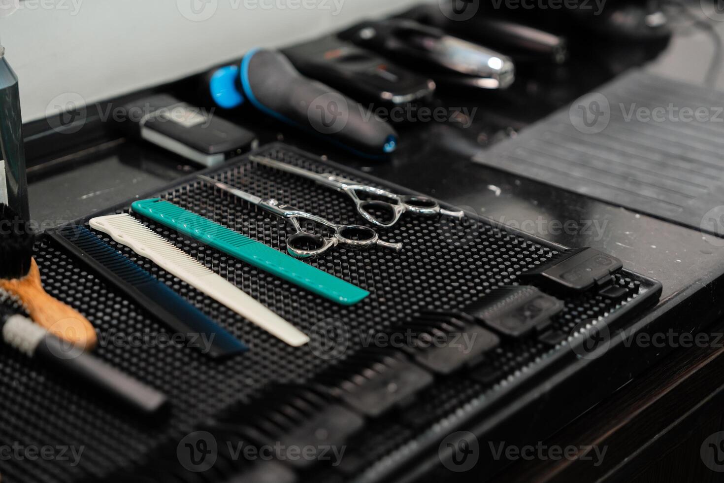 Hair cutting tools arranged neatly on a barber table in a modern salon photo
