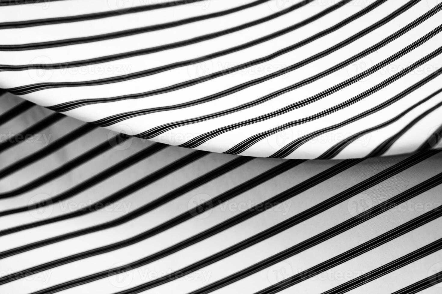 Striped fabric patterns create a dynamic visual contrast and texture play photo