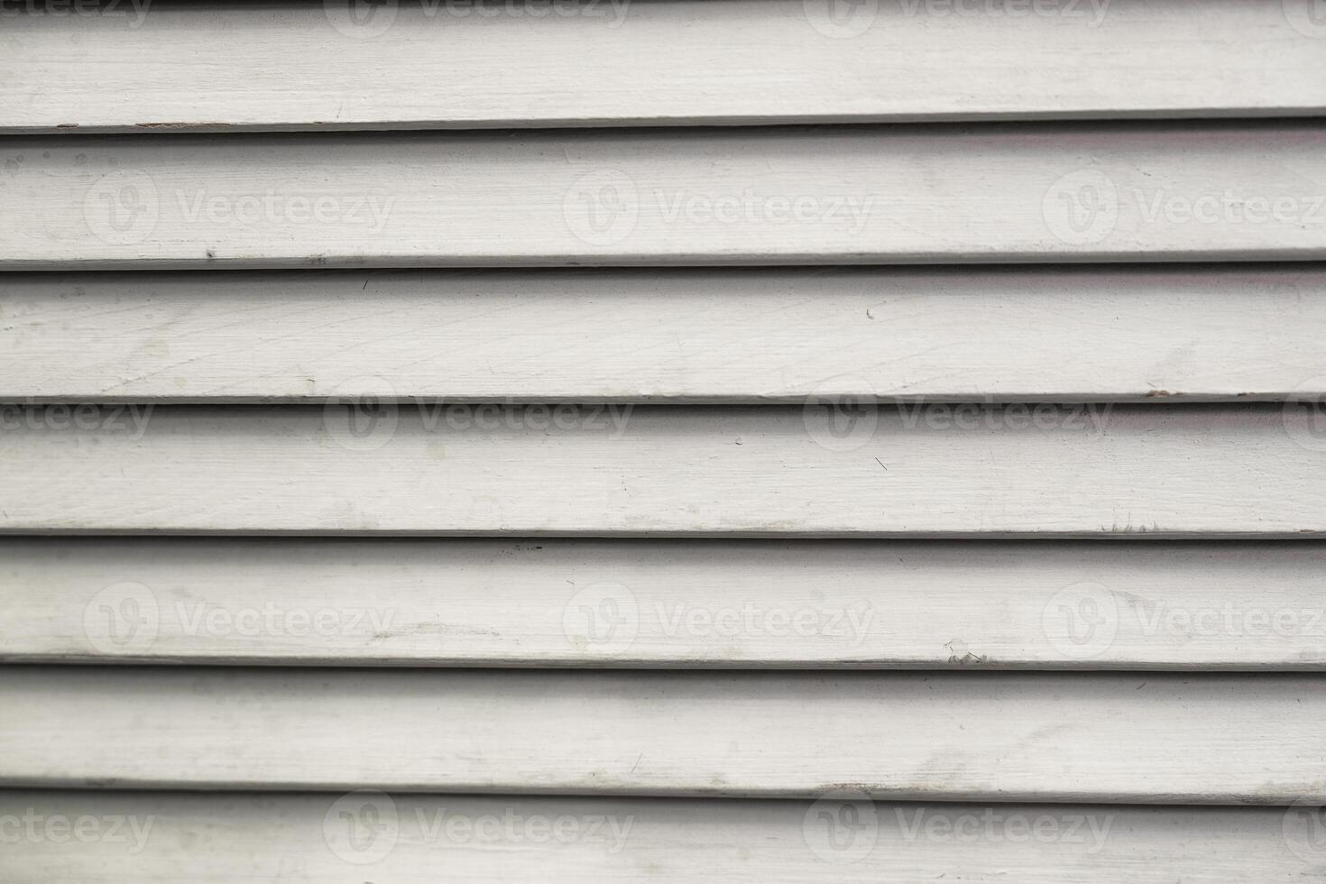 Gray wooden siding with horizontal lines in a residential setting photo