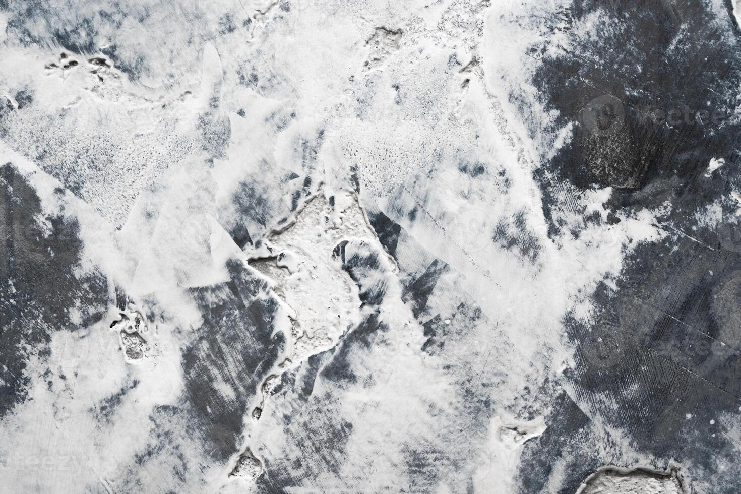 Abstract black and white texture resembling icy surface with natural patterns photo