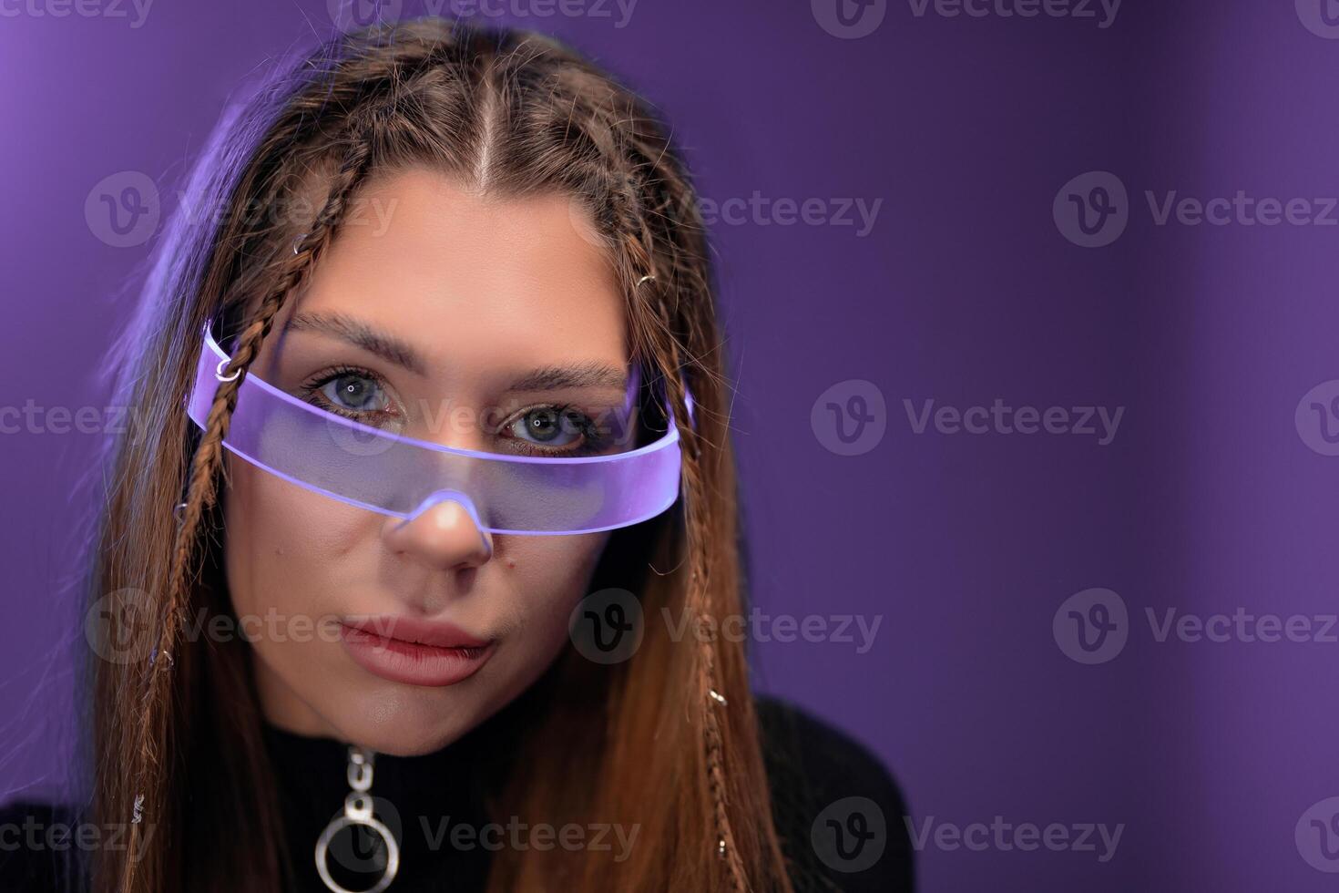 Young woman in cyber glasses. Gadgets of the future. photo