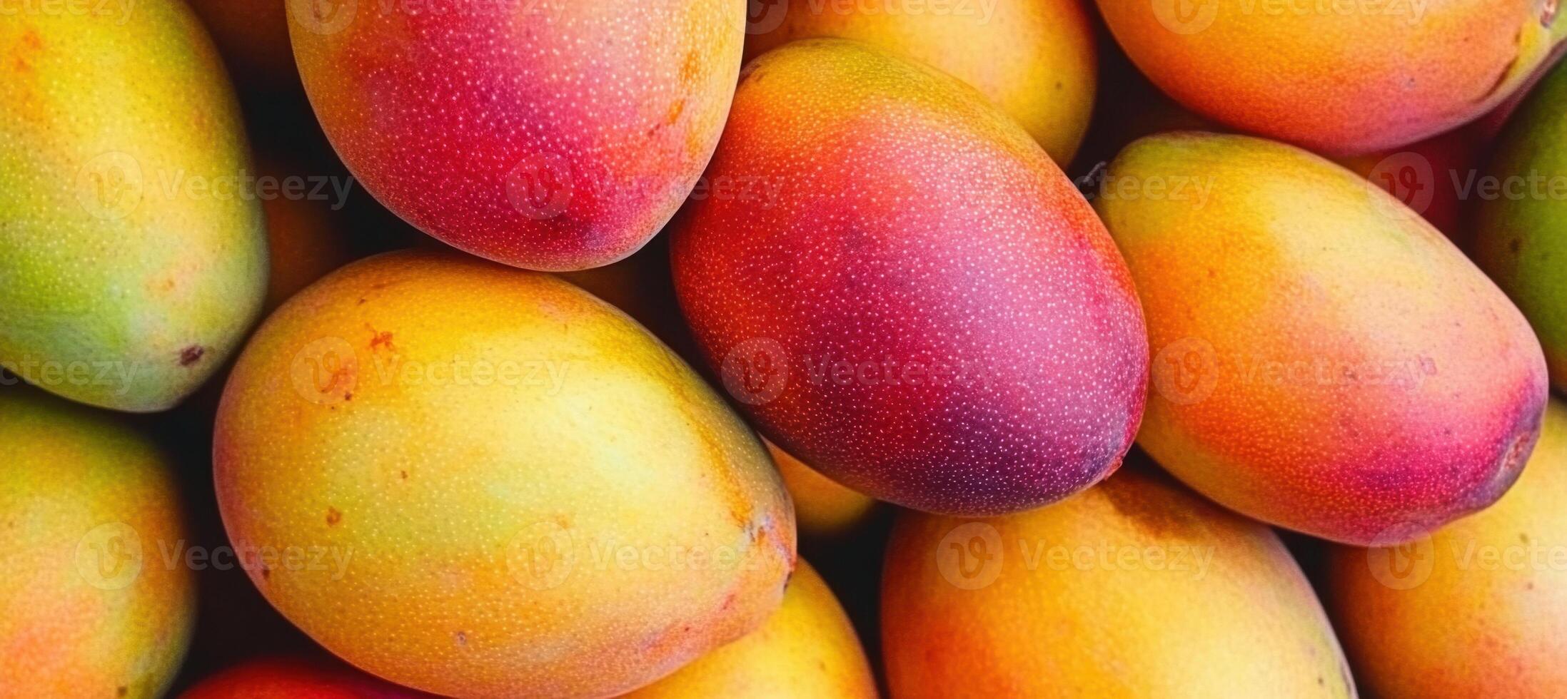 Fresh and Juicy Mangoes Piled Together for Sale at Market photo