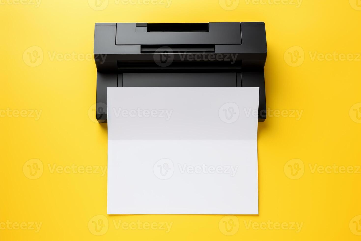 Black printer printing blank paper on yellow background photo