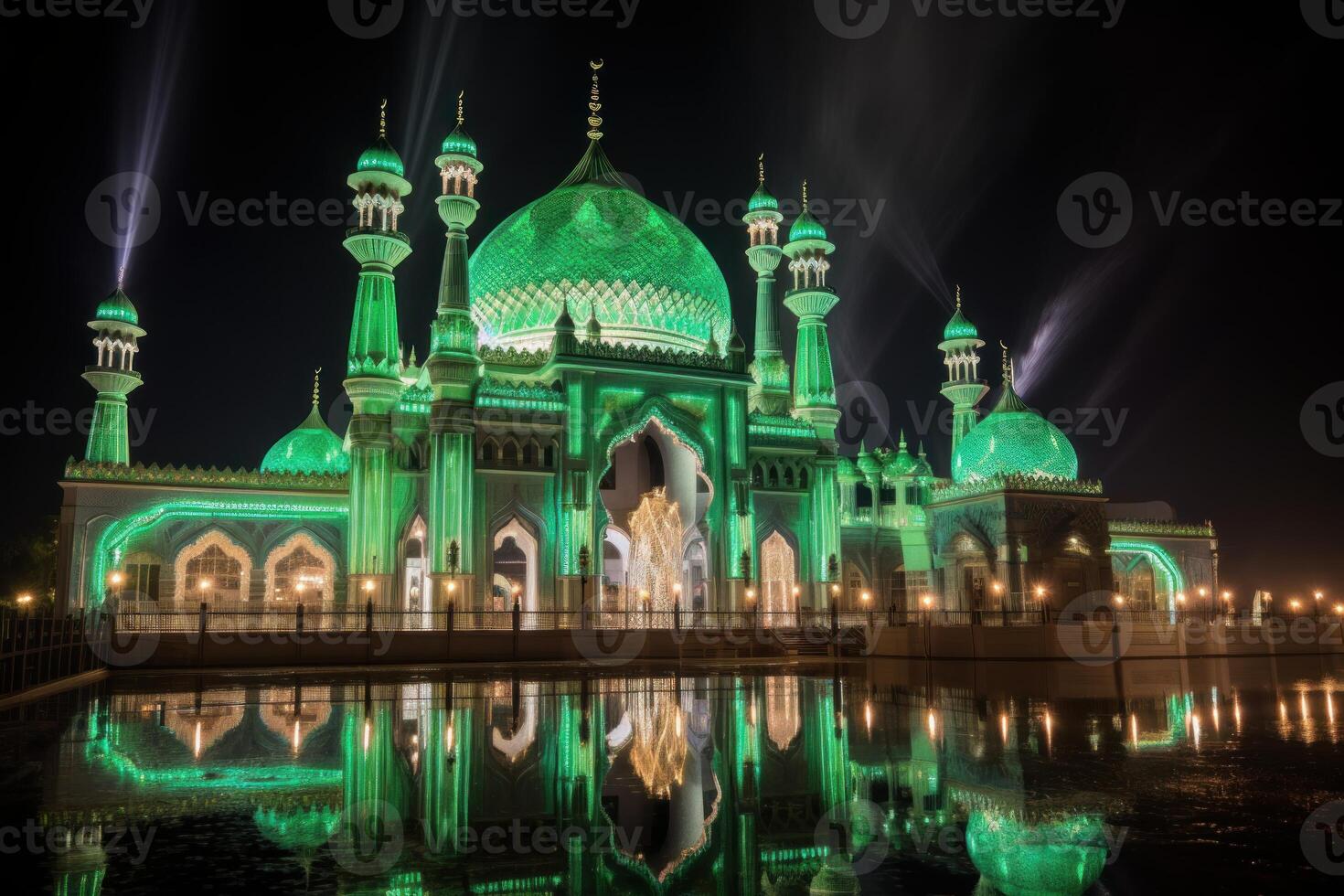 Crystal mosque illuminating the night with green lights and reflections photo
