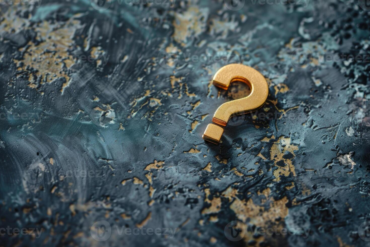 Golden question mark symbol is lying on dark blue textured background photo