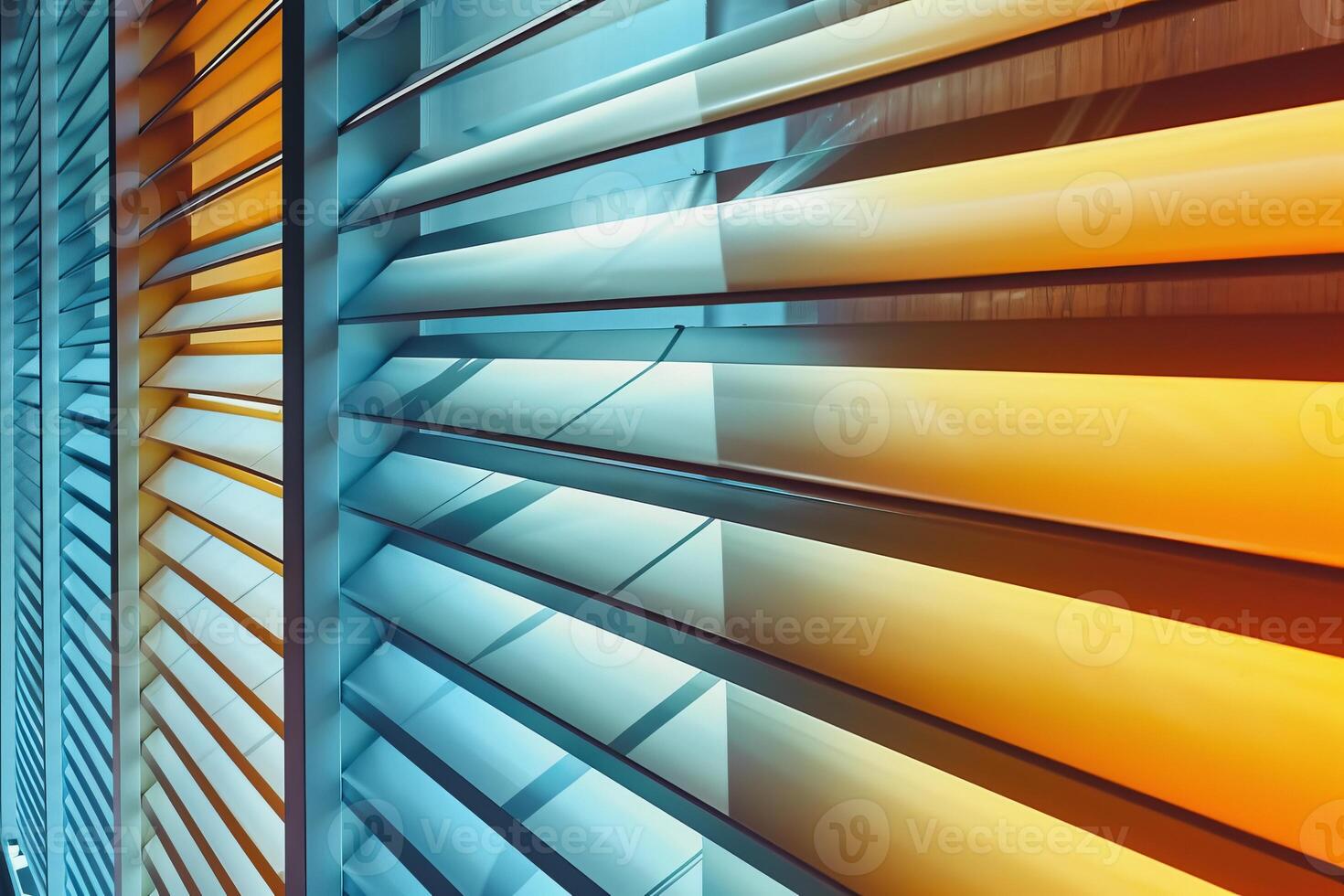 Modern building facade featuring geometric pattern with orange and blue gradient lighting photo