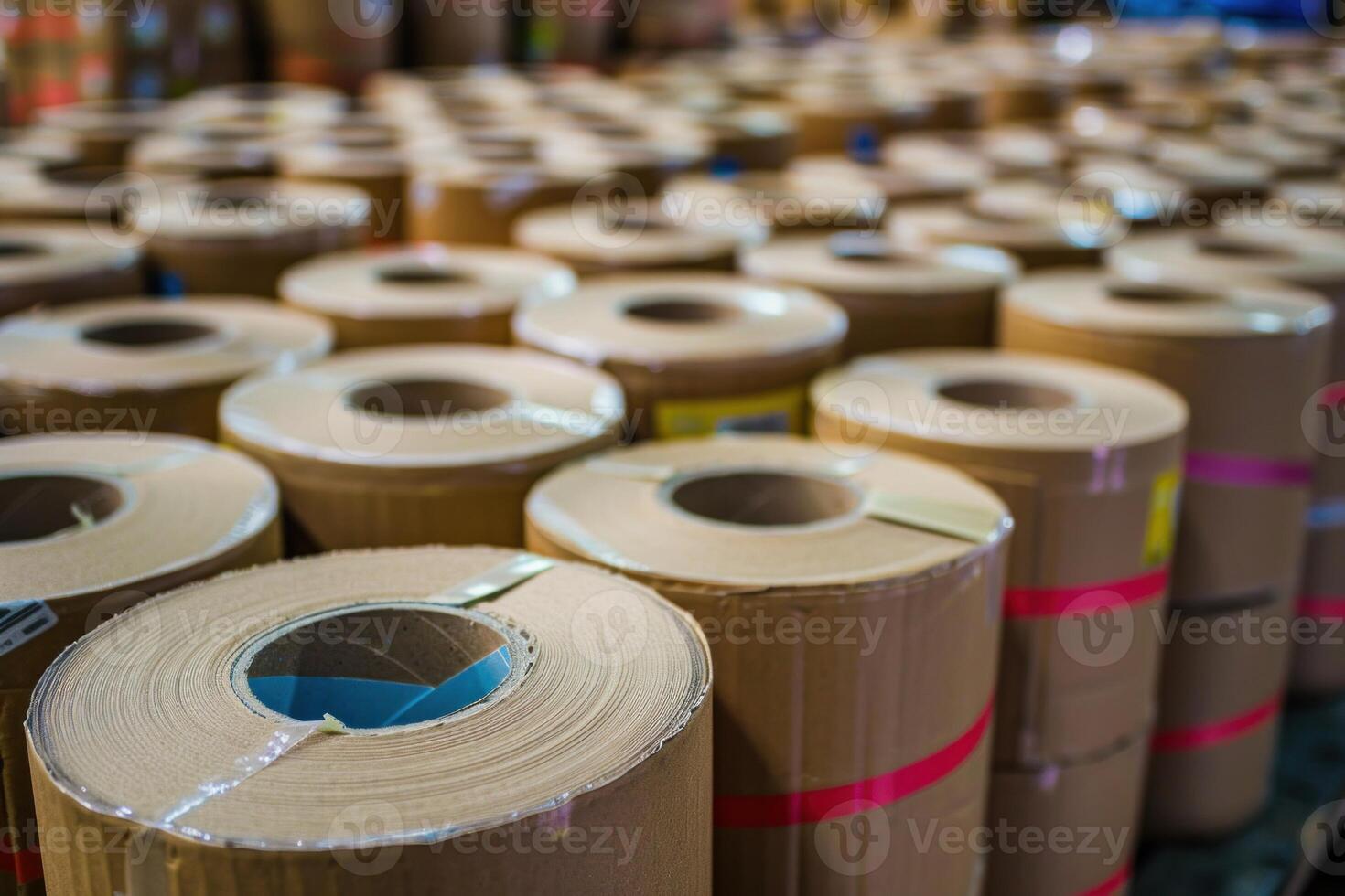 Cardboard rolls stacked in a printing factory or warehouse photo