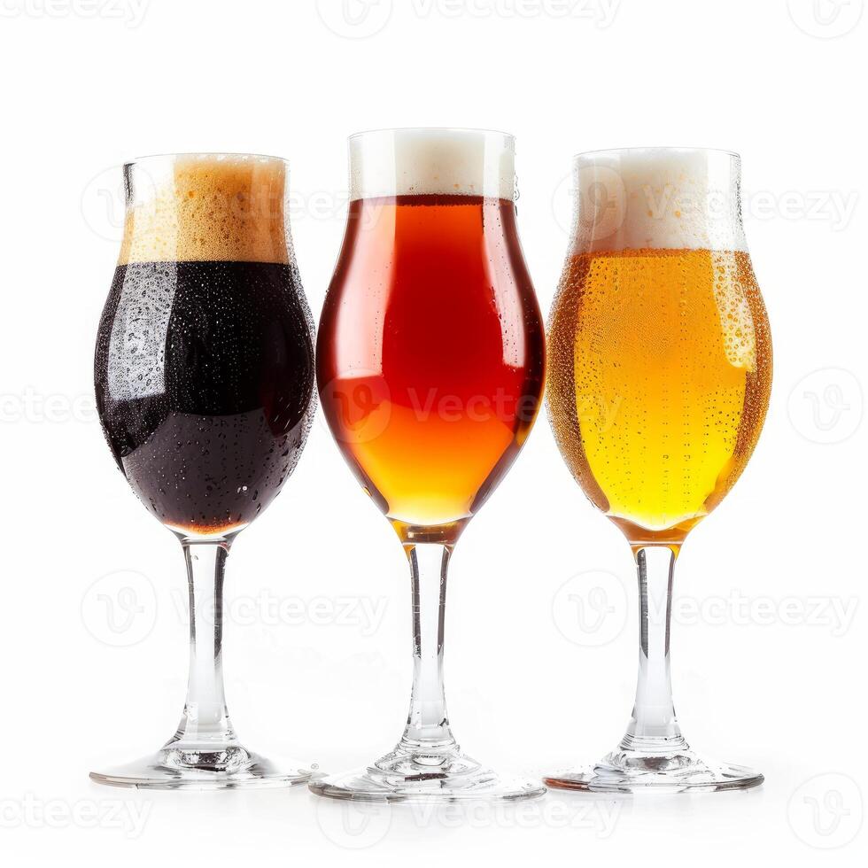 Three beer glasses showing variety of colors on white background photo