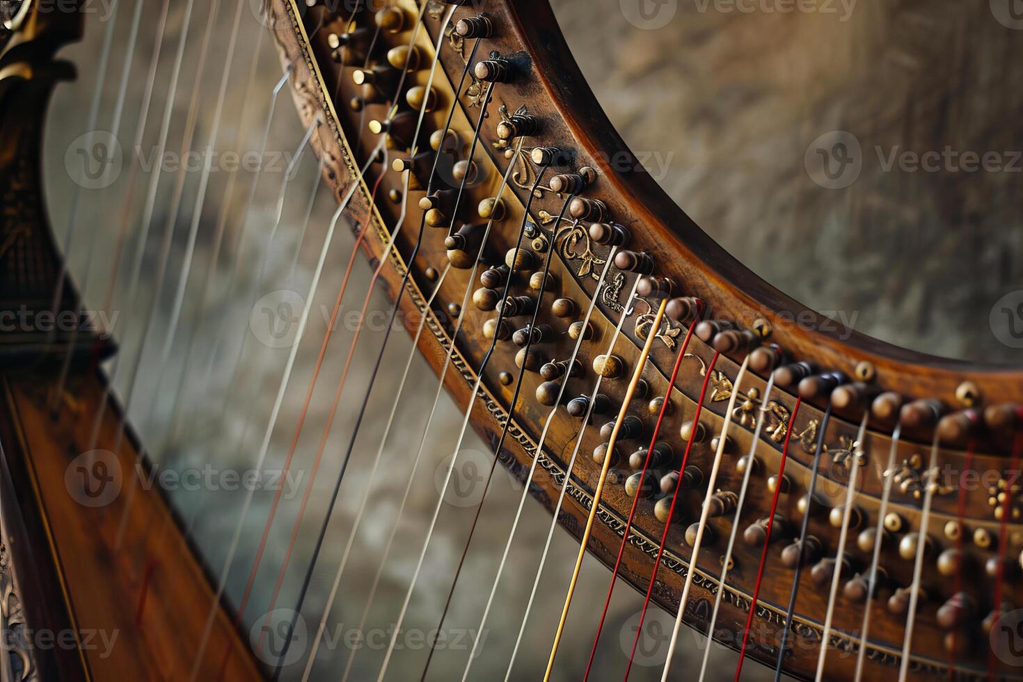 Closeup of harp strings and tuning pegs in warm light photo