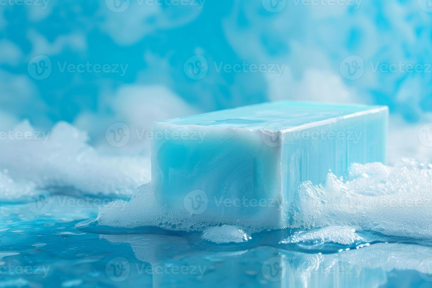 Blue soap bar floating on water surface surrounded by soap suds photo