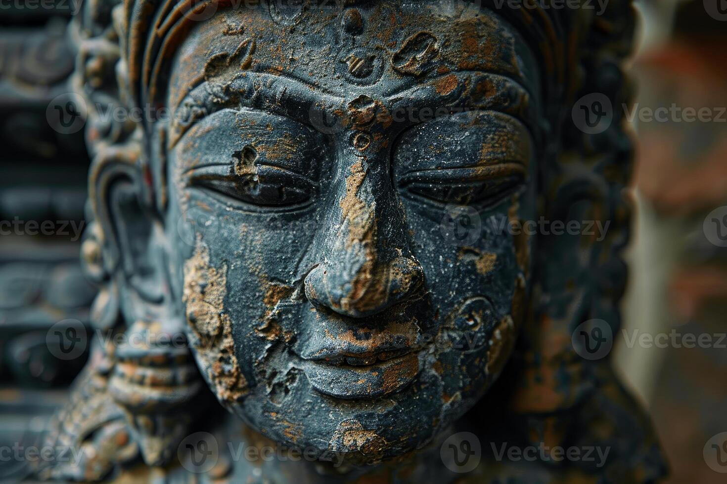 Ancient stone statue showing the passing of time photo