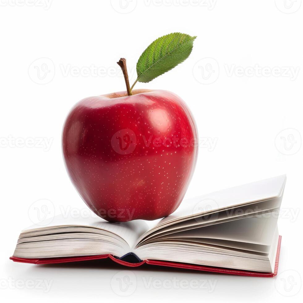 Red apple sitting on open book symbolizing education and knowledge photo