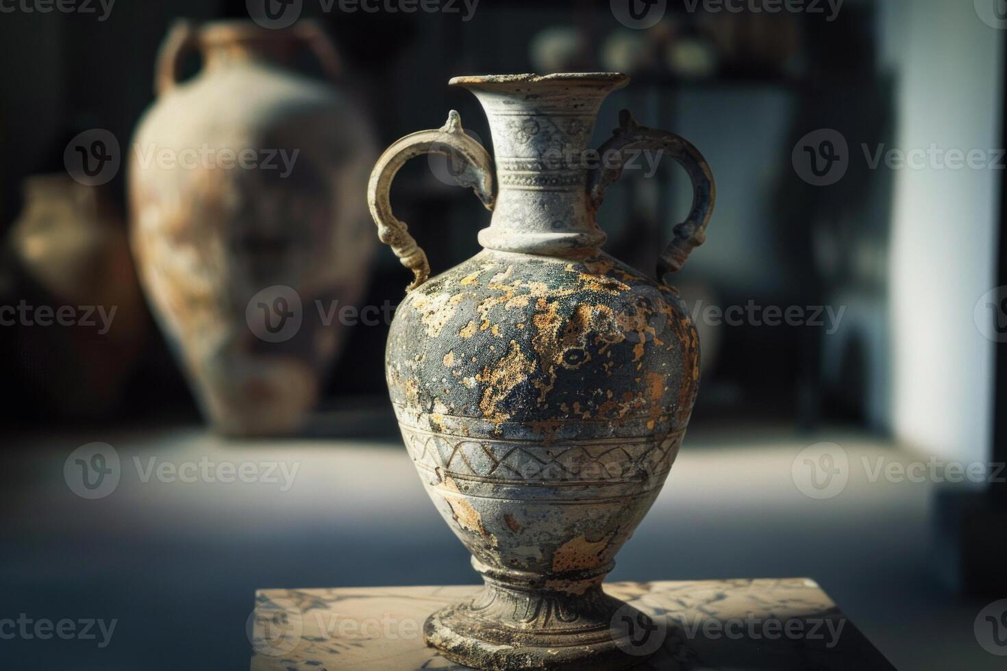Ancient greek amphora standing on stone pedestal in museum photo