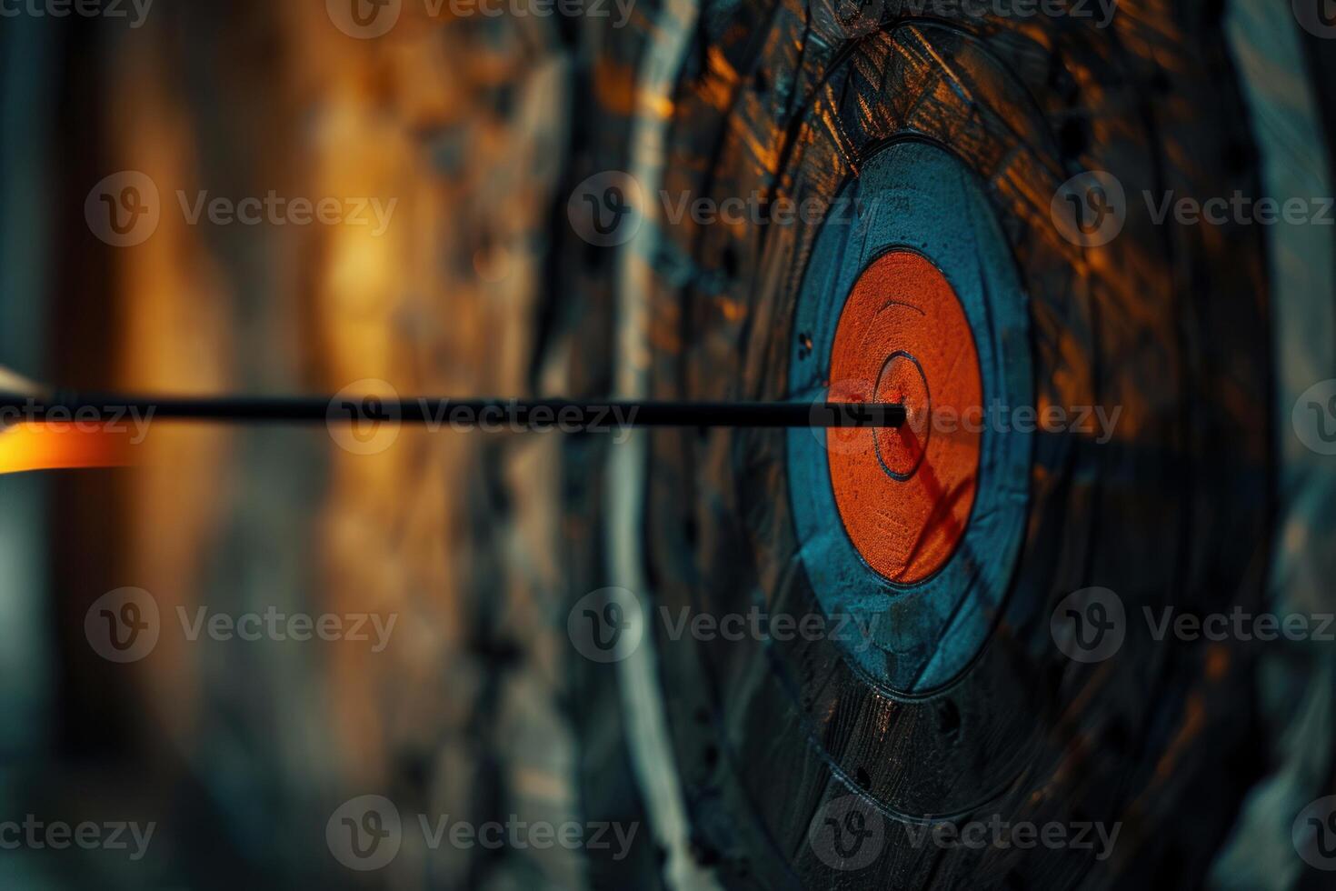 Burning arrow hitting the center of target on archery board photo