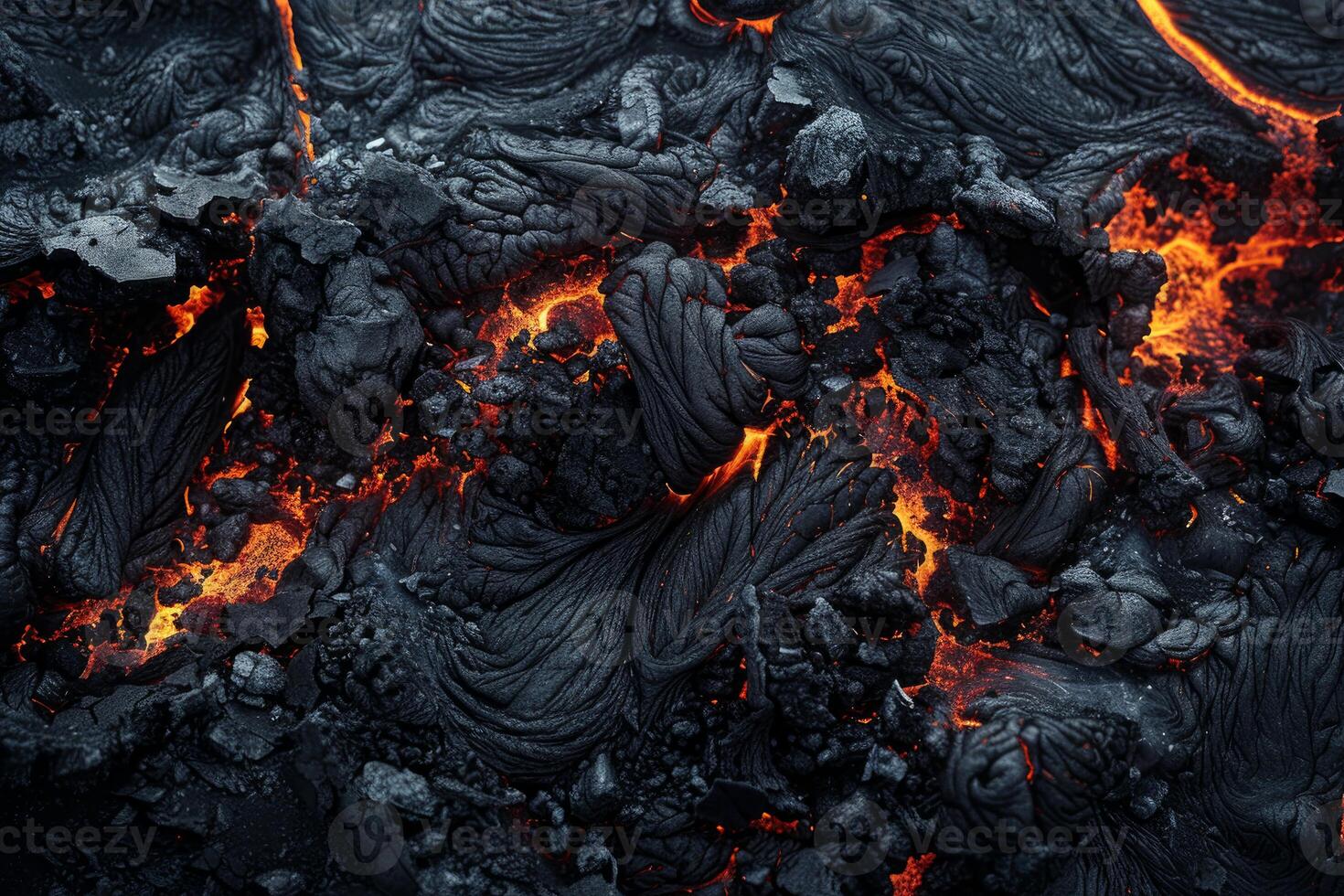 Solidified lava flow creating an abstract pattern with glowing cracks photo