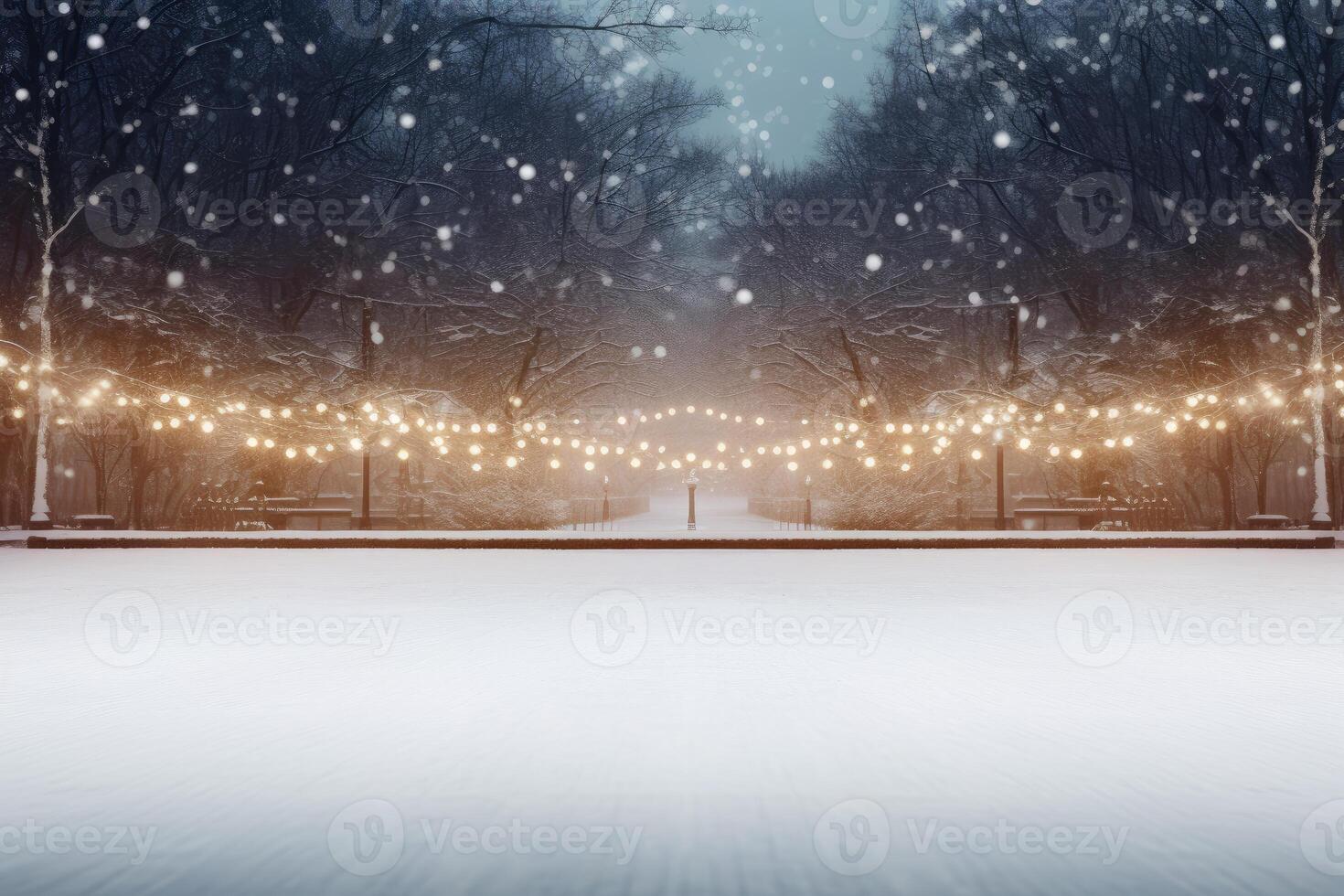 Snow falling on city park path with string lights at dusk photo
