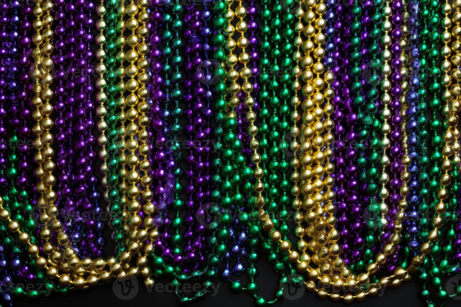 Colorful mardi gras beads hanging in vertical rows creating festive background photo