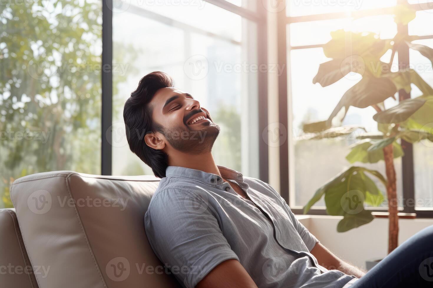 Young man relaxing on sofa, enjoying leisure time at home photo