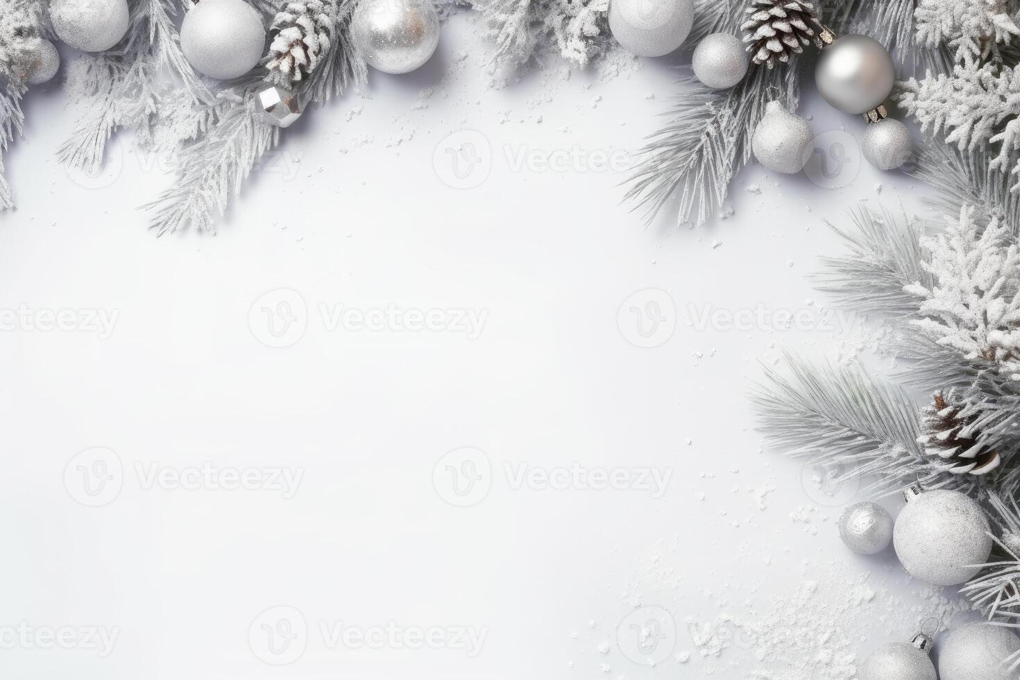 Christmas composition with silver ornaments framing a white background photo