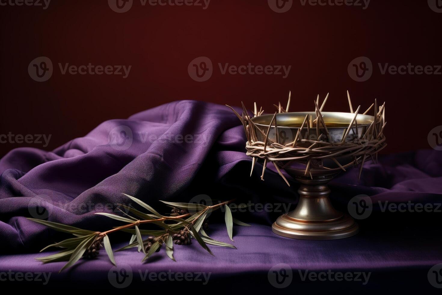 Crown of thorns resting on chalice with olive branch and purple cloth symbolizing sacrifice and remembrance photo