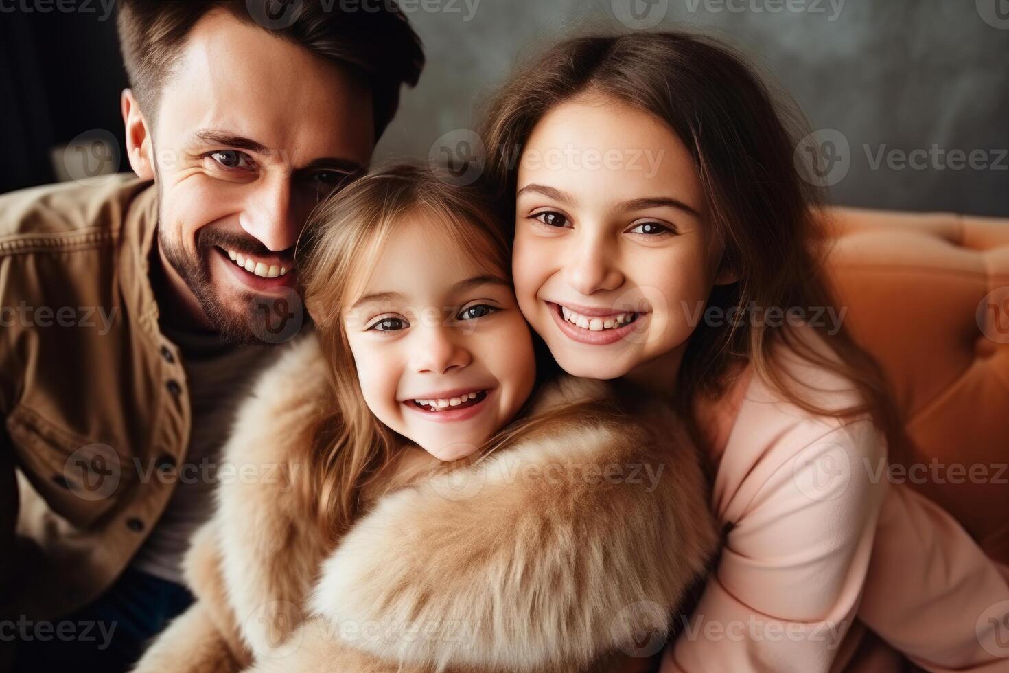 Happy family smiling and embracing on sofa at home photo