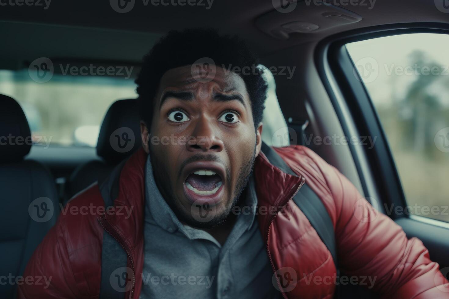 Shocked driver screaming in fear inside car during road trip photo