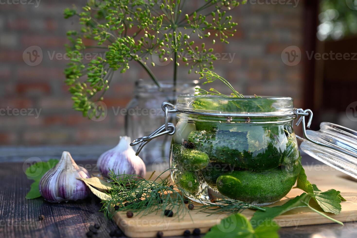 a set of ingredients for pickling cucumbers, pickled cucumbers, brine On a beautiful sunny morning photo