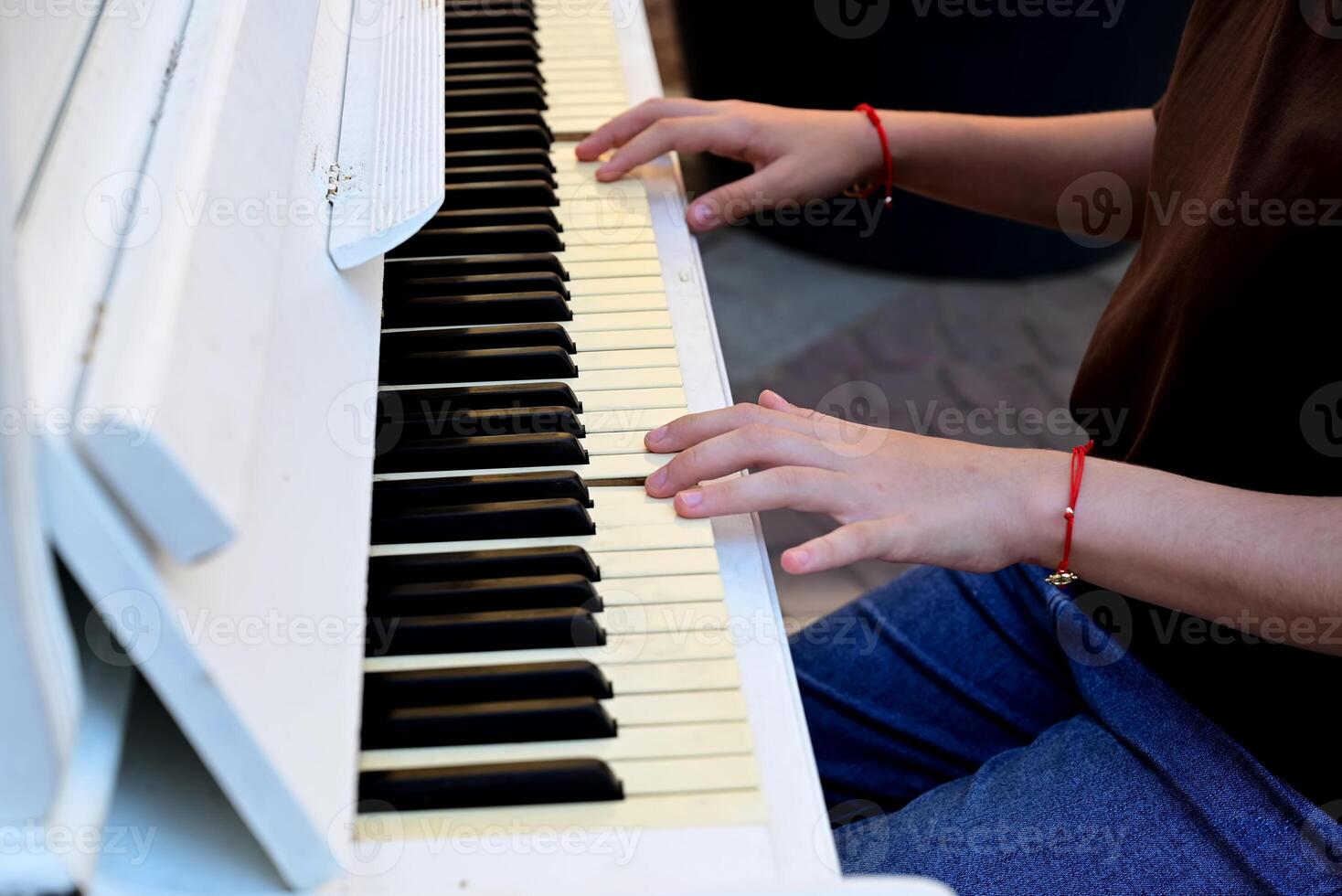 women's hands play the piano On a beautiful day photo