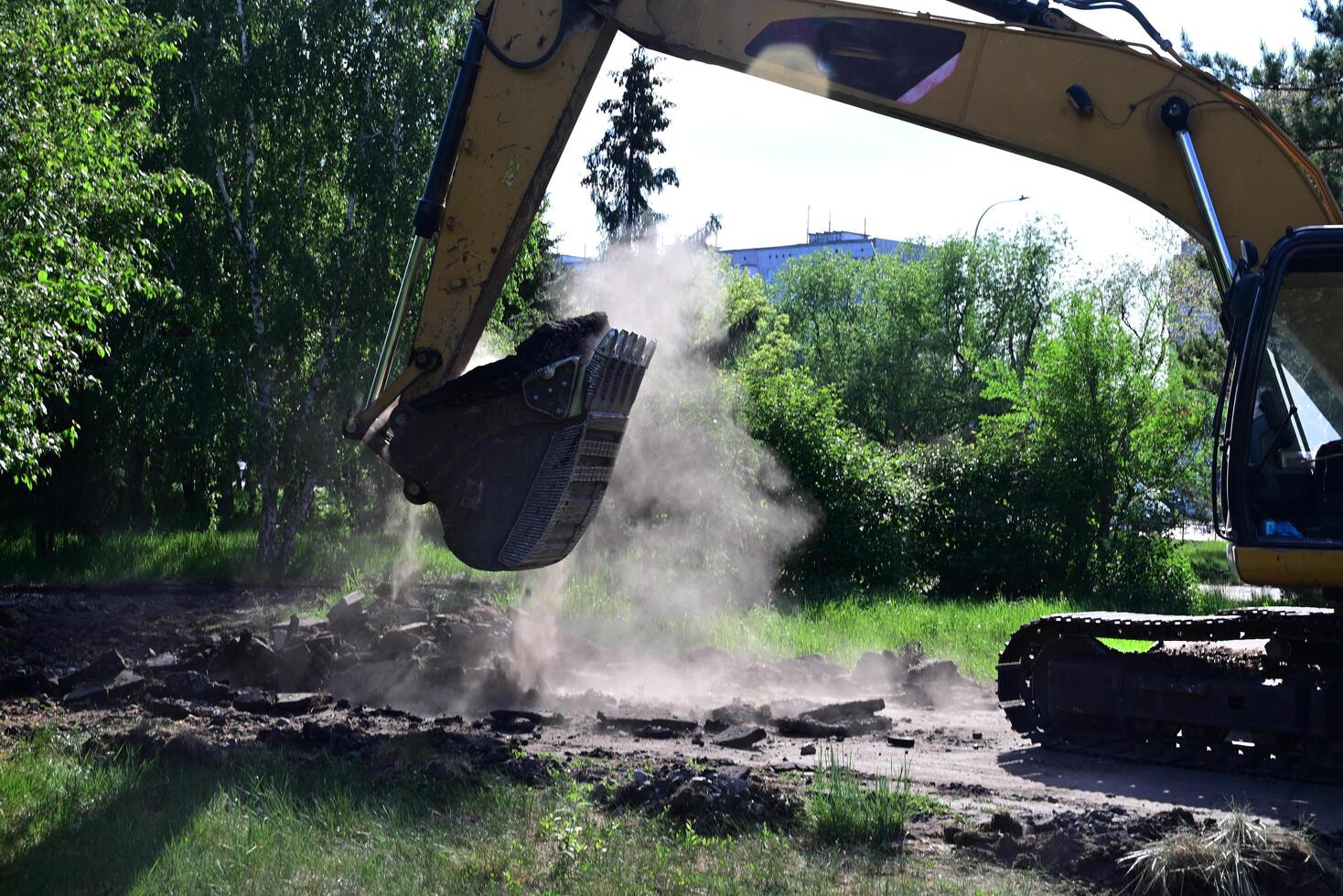 Excavator during earthmoving on a sunny day photo