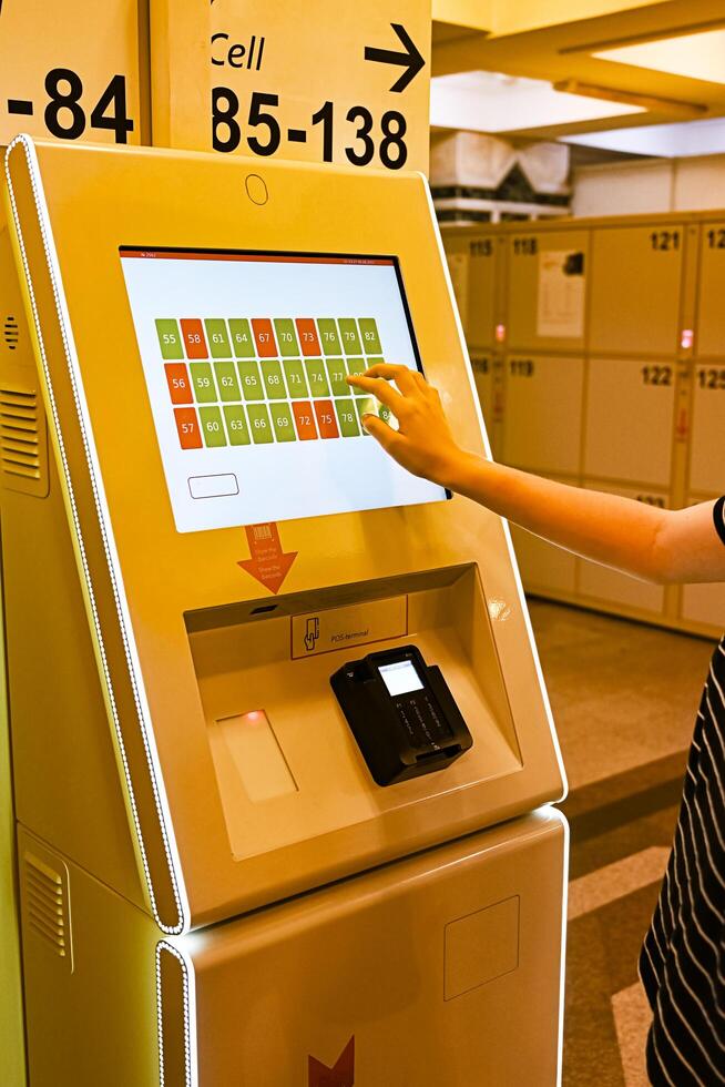 luggage storage at the train station, contactless payment using the terminal on a wonderful day photo