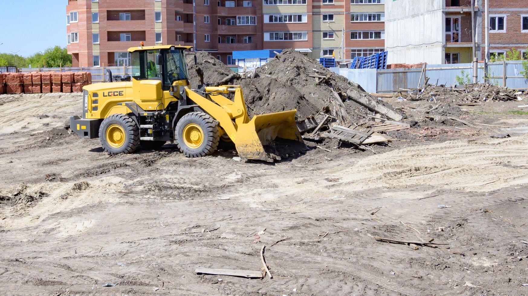 excavator is working on a wonderful day photo