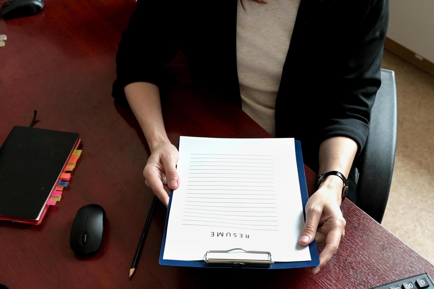 A close-up of employers or recruiters considering candidates' resumes, interviews, the concept of employment and recruitment, tips on making a good resume template, applying for a job photo