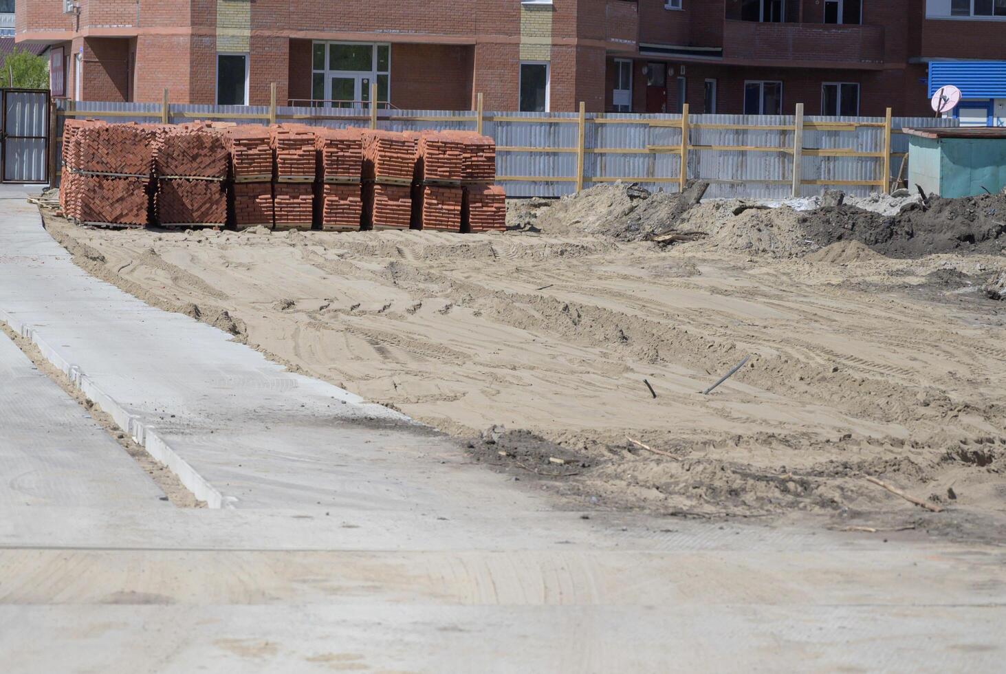 excavator is working and digging at construction site on a wonderful day photo