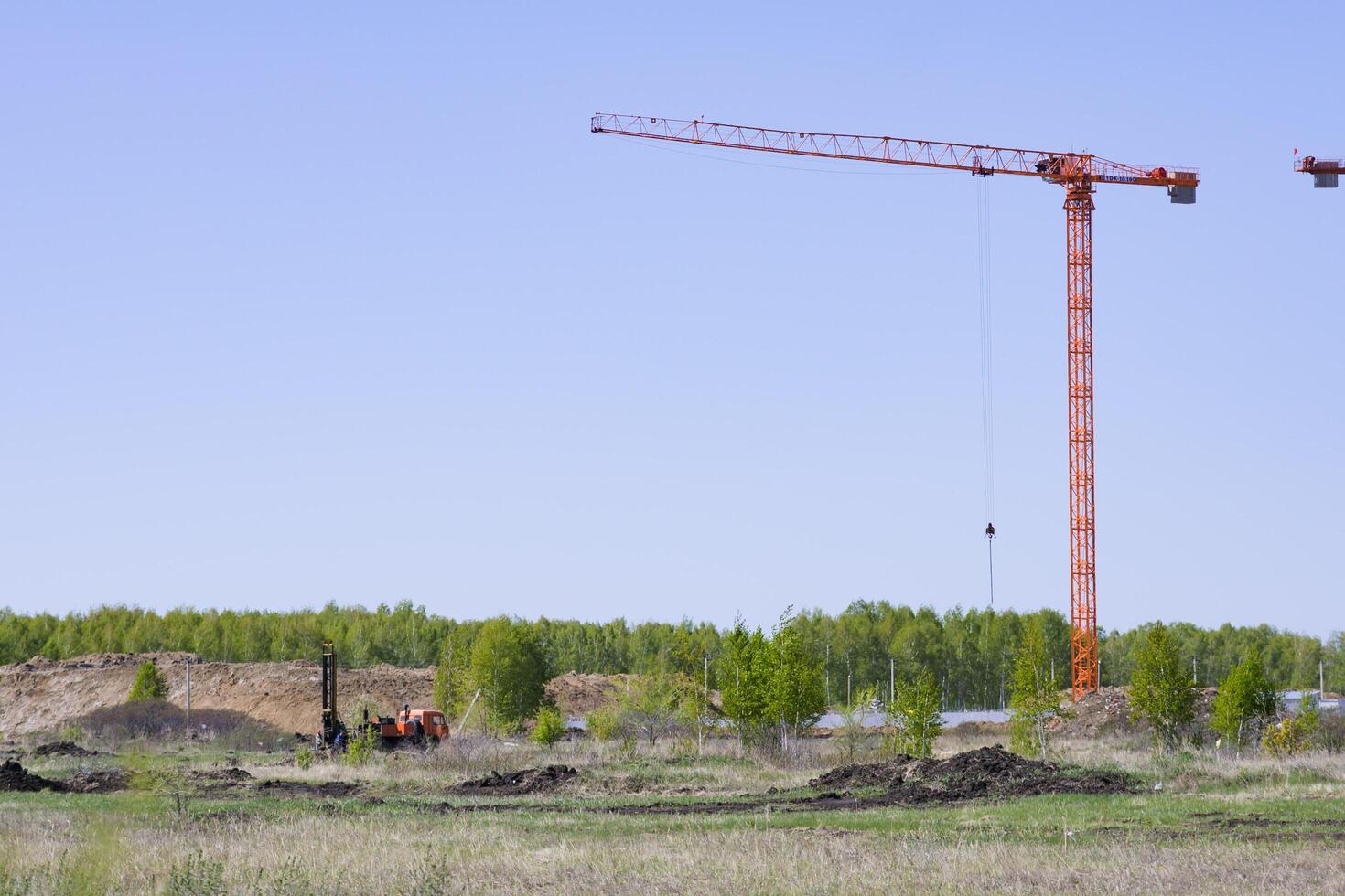 Construction of new residential high-rise buildings On a wonderful day with a positive attitude. Against the background of a yellow sunset sky. photo