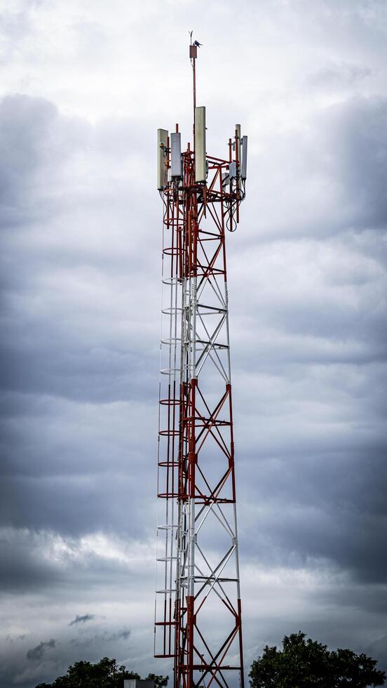 Signaling tower in cloudy sky photo