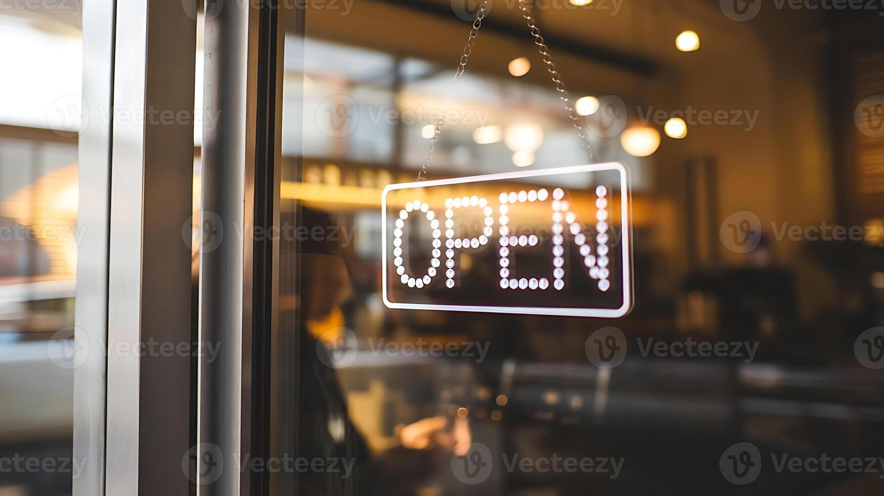 Illuminated Open Sign on Glass Door for Business Welcoming Customers with Warm Light photo
