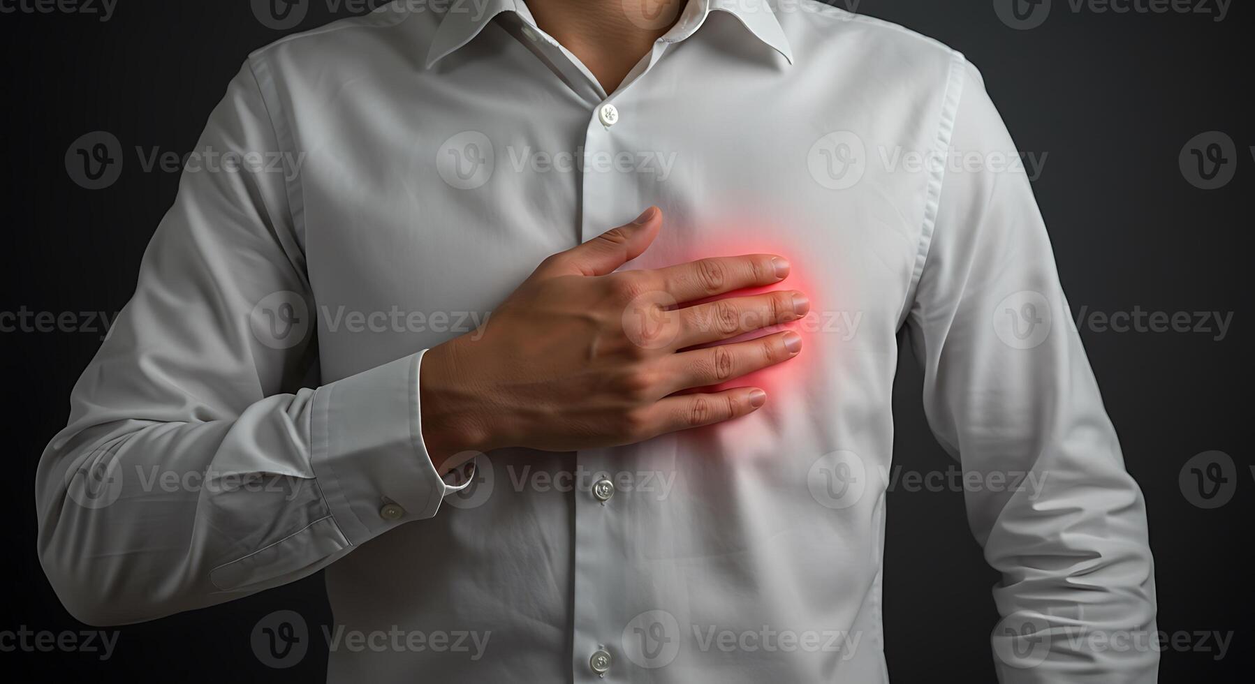 Man in white shirt with chest pain with isolated background photo
