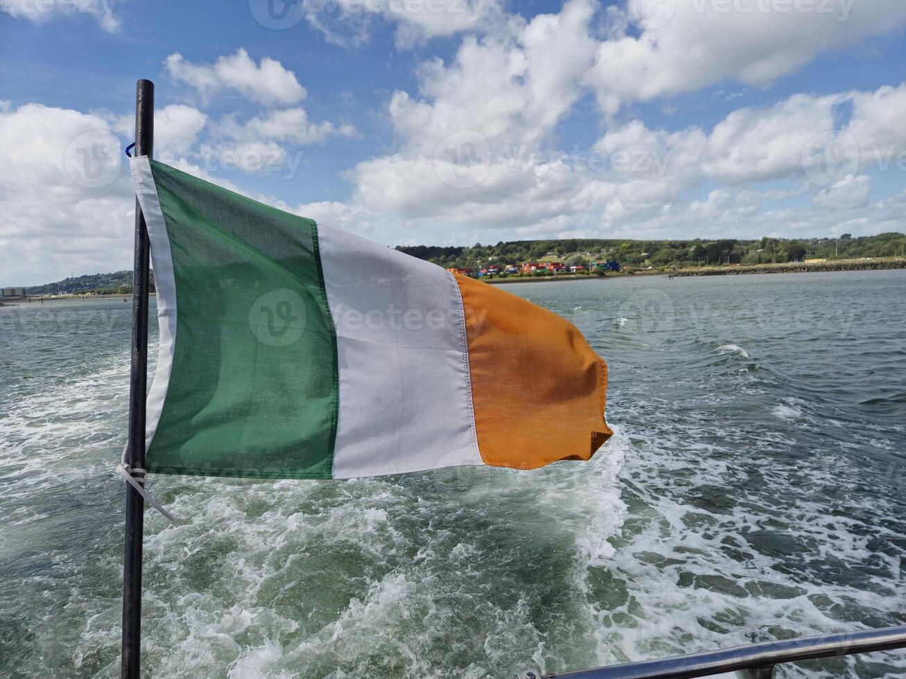 Tricolor Glory, The Irish Flag Overlooking a Tranquil River photo