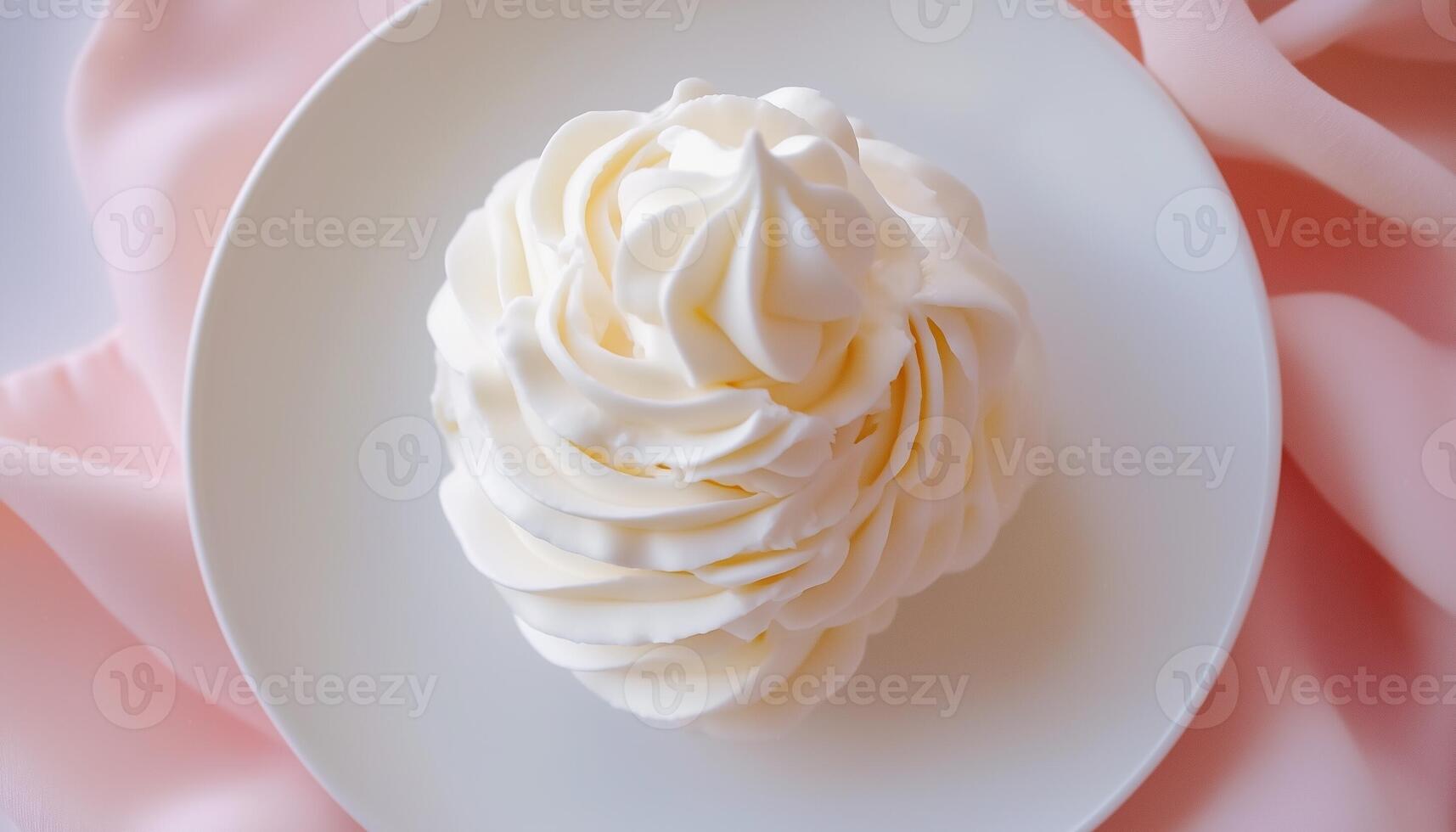 White vanilla frosting swirl cream smooth whipped for baking on white plate pink background photo