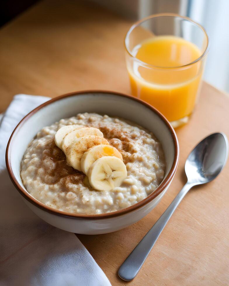 Healthy Oatmeal Breakfast with Banana and Orange Juice photo