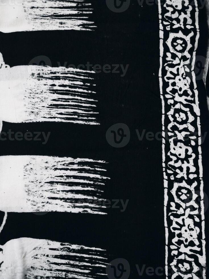 a black and white photo of a scarf with a pattern