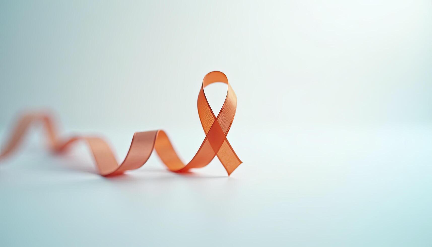 Orange Ribbon for Self Injury Awareness Day Symbol with text placement area photo
