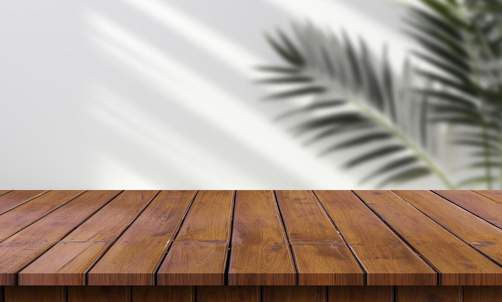 Wooden table top with palm tree in the background photo