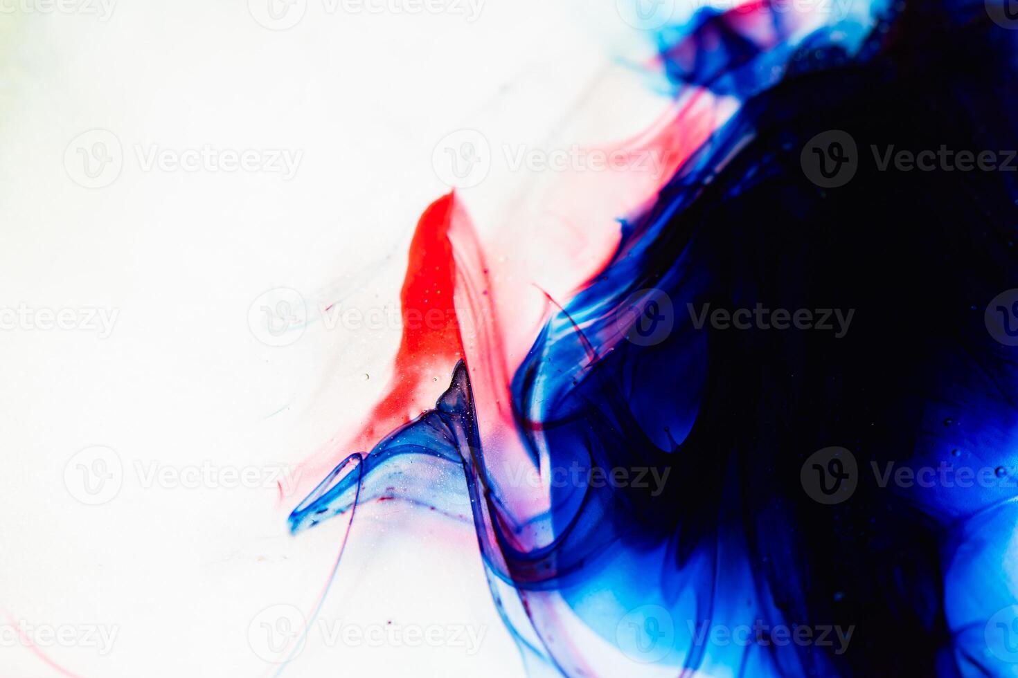 Abstract Pattern of Blue and Red Ink Mixing in Water. A Visually Captivating and Dynamic Composition Showcasing Fluid Dynamics and the Aesthetic Appeal of Abstracts photo