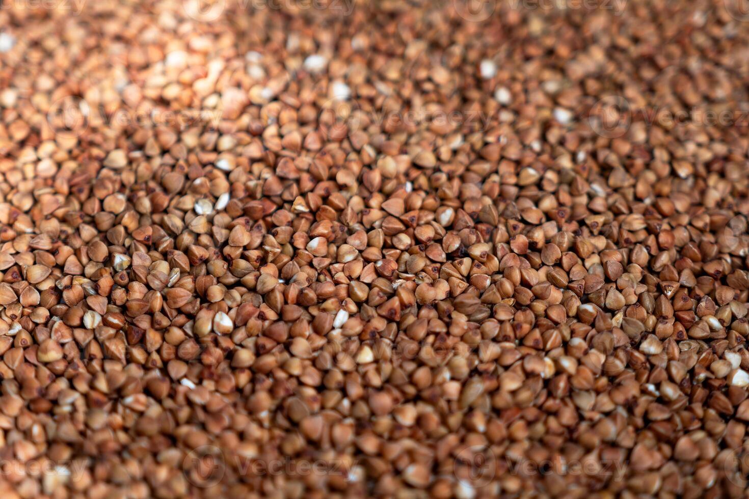Close-Up View of Buckwheat Groats. Ideal for Nutrition Articles, Culinary Blogs, and Health-Related Marketing Materials photo