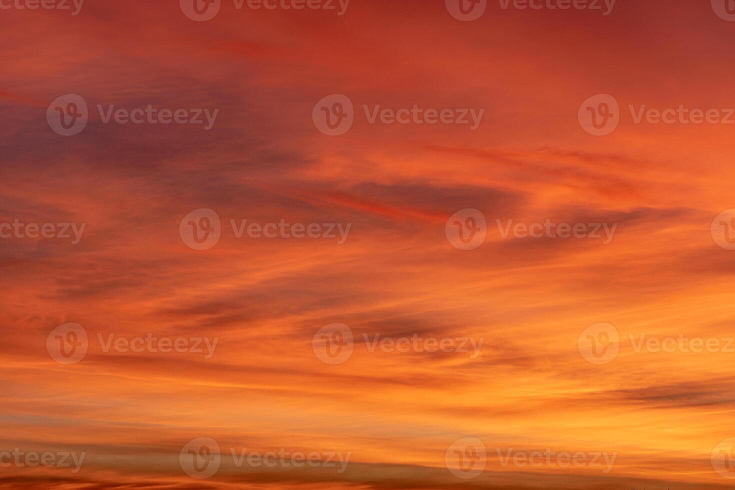 Soft orange and pink hues paint the evening sky, enveloping the landscape in a serene and peaceful atmosphere photo