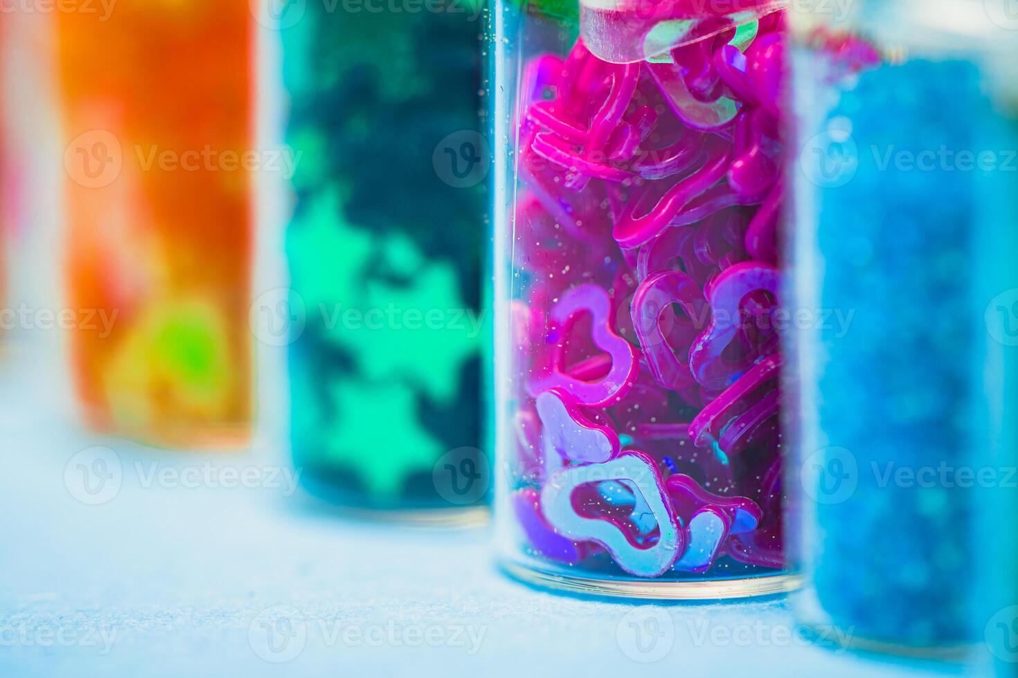 Orange and Yellow Mixture, Green Star-Shaped Objects, Pink and Purple Number Shaped Objects, Blue Granular Material - Perfect for Crafting, Sorting, Educational Activities photo