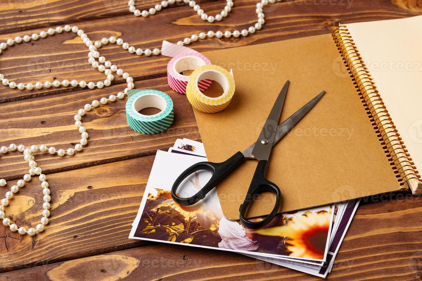 Crafting supplies on a wooden table ready for creative projects in a cozy workspace photo