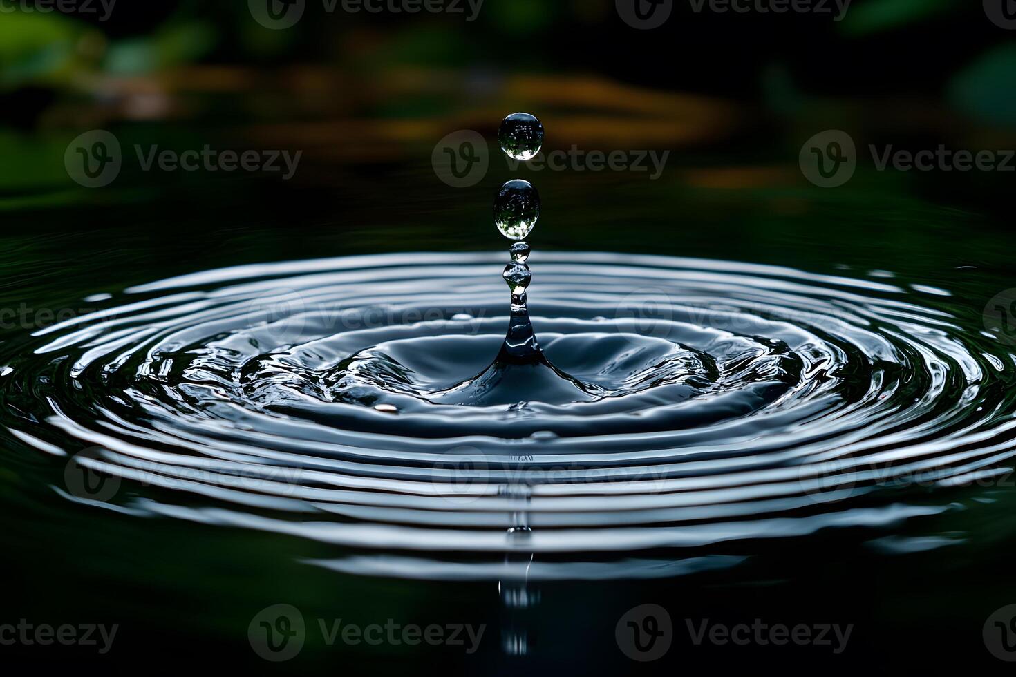 Tranquil Water Droplet Splash with Rippling Waves in Nature photo